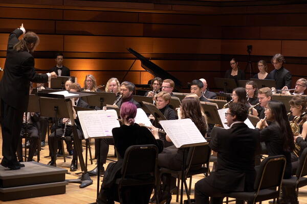 concert band on stage with conductor